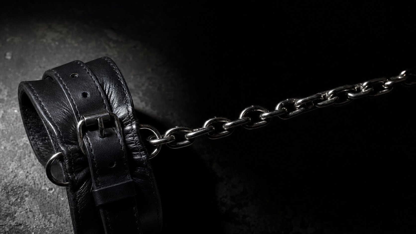 Editorial bondage-inspired styling with dramatic shadows